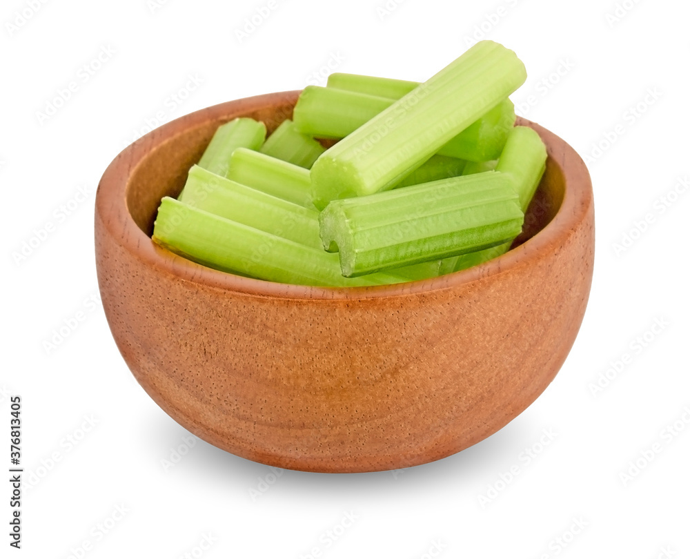 Celery in wooden bowl isolated on white background
