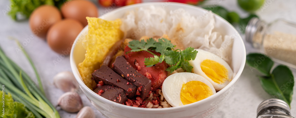 Yentafo with boiled egg, spring onion, chili, lime and garlic. Yentafo with boiled egg, spring onion, chili, lime and garlic.