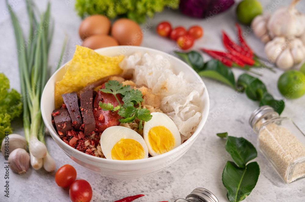 Yentafo with boiled egg, spring onion, chili, lime and garlic. Yentafo with boiled egg, spring onion, chili, lime and garlic.