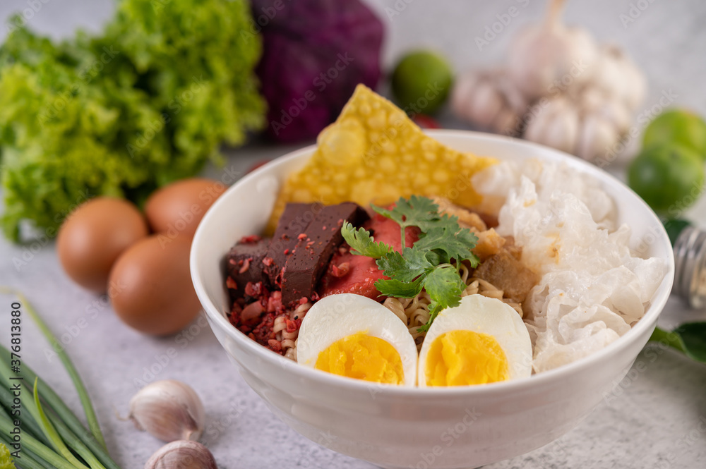 Yentafo with boiled egg, spring onion, chili, lime and garlic. Yentafo with boiled egg, spring onion, chili, lime and garlic.