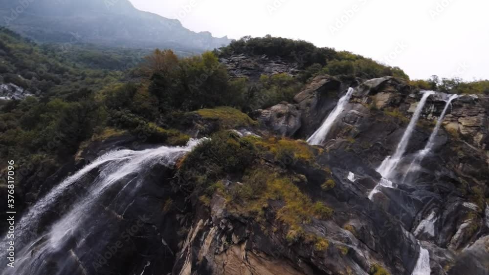 FPV drone shot diving down a waterfall 90 fps slow motion action cam FPV drone shot diving down a waterfall 90 fps slow motion action cam