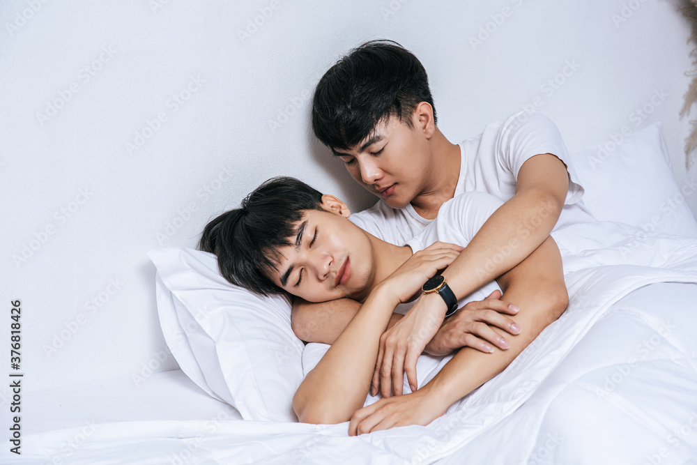 Two beloved young men slept in bed together. Two beloved young men slept in bed together.