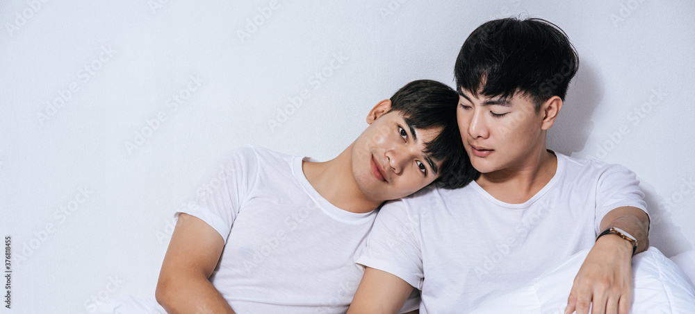 Fototapeta premium Two beloved young men slept in bed together.