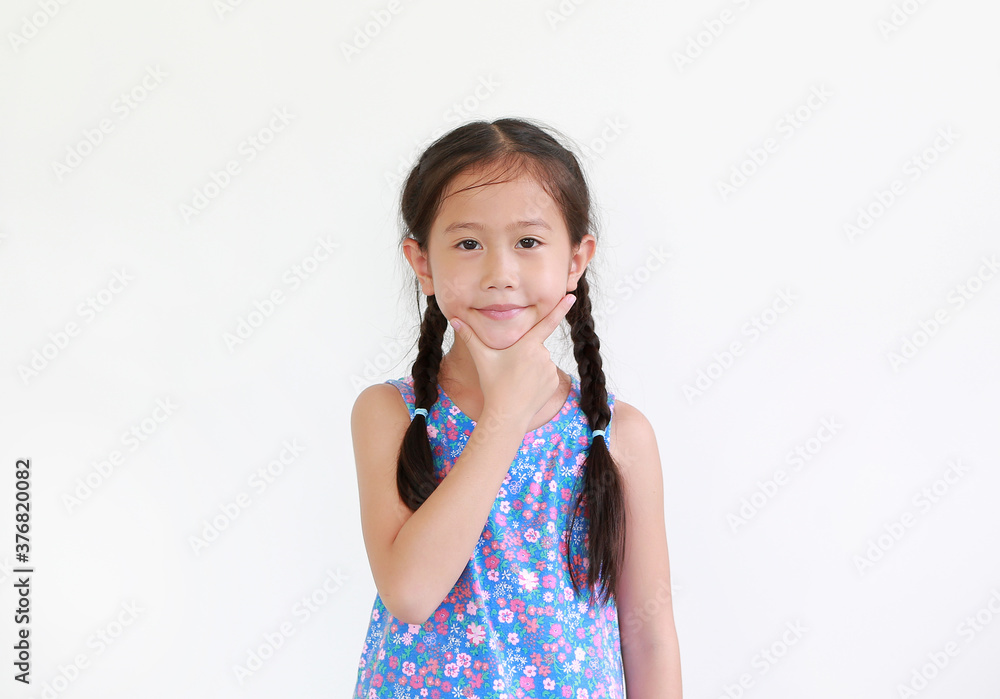 Portrait of little asian girl expression finger check mark sign under chin isolated on white background. Portrait of little asian girl expression finger check mark sign under chin isolated on white background.