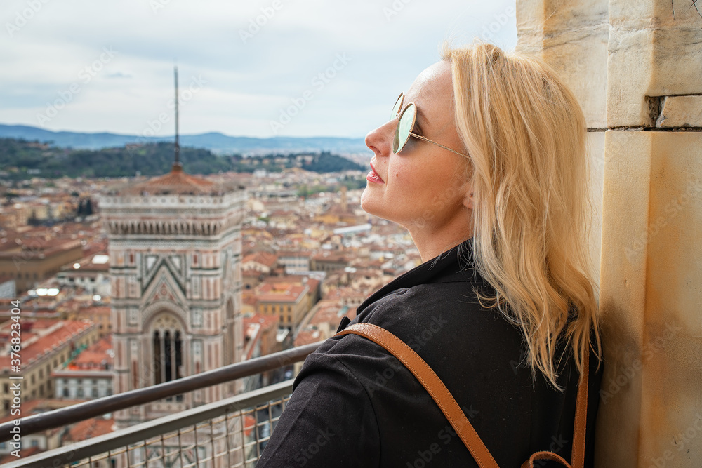 Beautiful woman and view of Florence, Italy