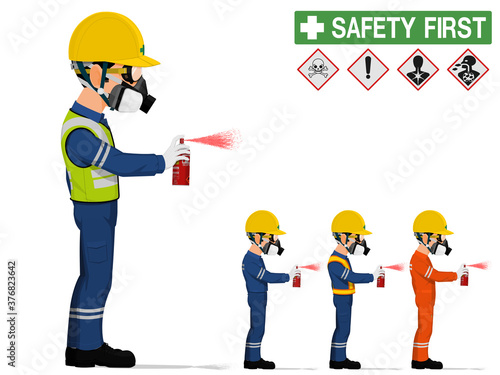 An industrial worker with respirator is spraying color