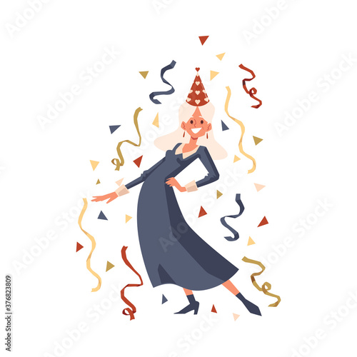 Happy old woman in party hat dancing with confetti