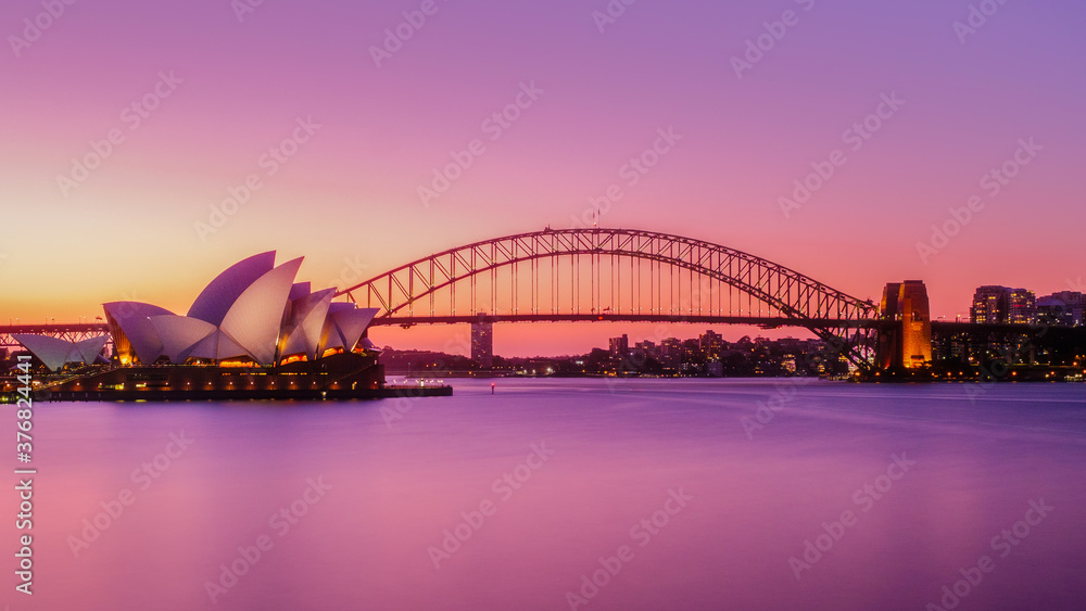 Naklejka premium sydney harbour bridge at sunset