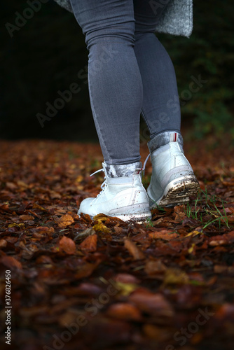 Walking on fallen leafs with boots autum vibes