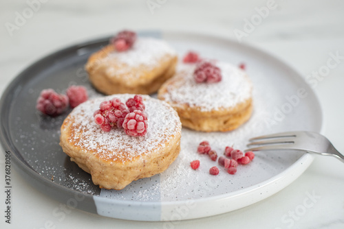 sweet home made vanilla pancakes with raspberries
