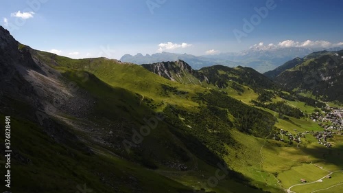 Panorama wide angle view of Malbun Valley in the Principality of Liechtenstein. Alpstein range in the background. Pan left over the surrounding mountains of the alps photo