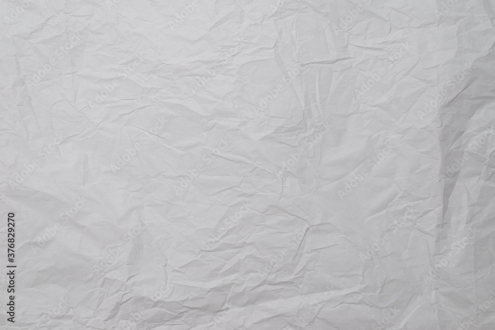 Obraz premium Crumpled white paper background.