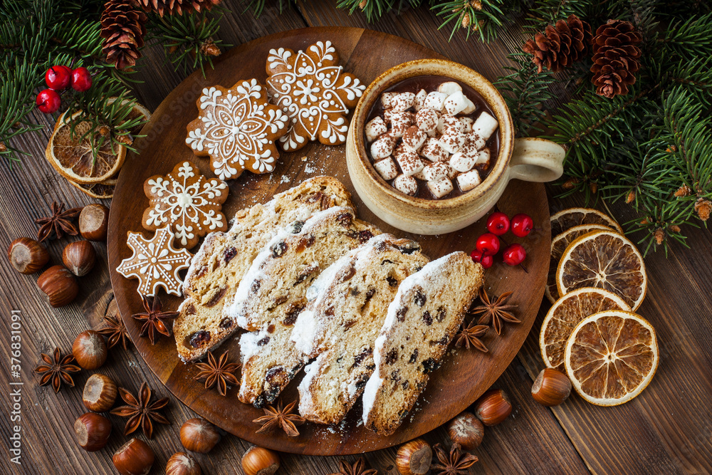 Cup of hot chocolate with marshmallows and Christmas stollen Cup of hot chocolate with marshmallows and Christmas stollen