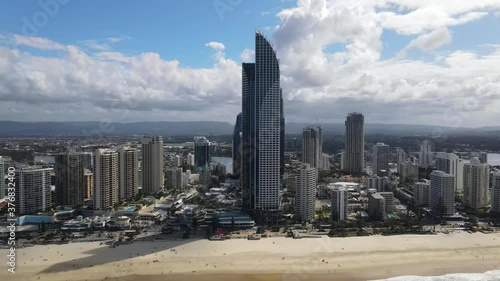Soul Tower Building Near Cavill Avenue - Surfers Paradise On Summer - Gold Coast, Queensland, Australia.  - aerial tilt down photo