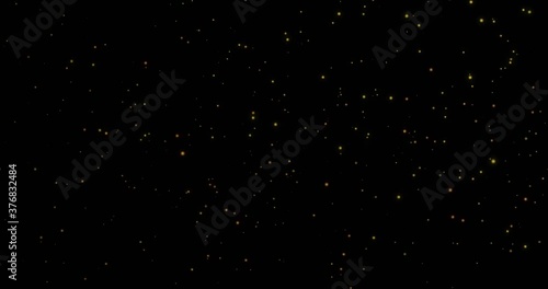 Appearing and disappearing golden particles. Confetti fountain for a festive background. Scattering magic shining dust.