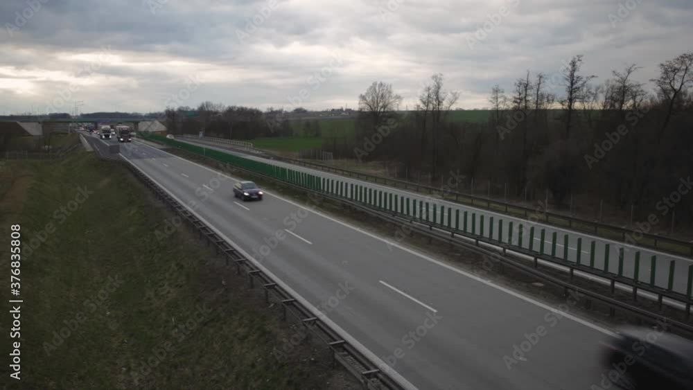 Transport Vehicles On The Highway In Zlotoryja, Poland On A Cloudy Day - high angle shot Transport Vehicles On The Highway In Zlotoryja, Poland On A Cloudy Day - high angle shot