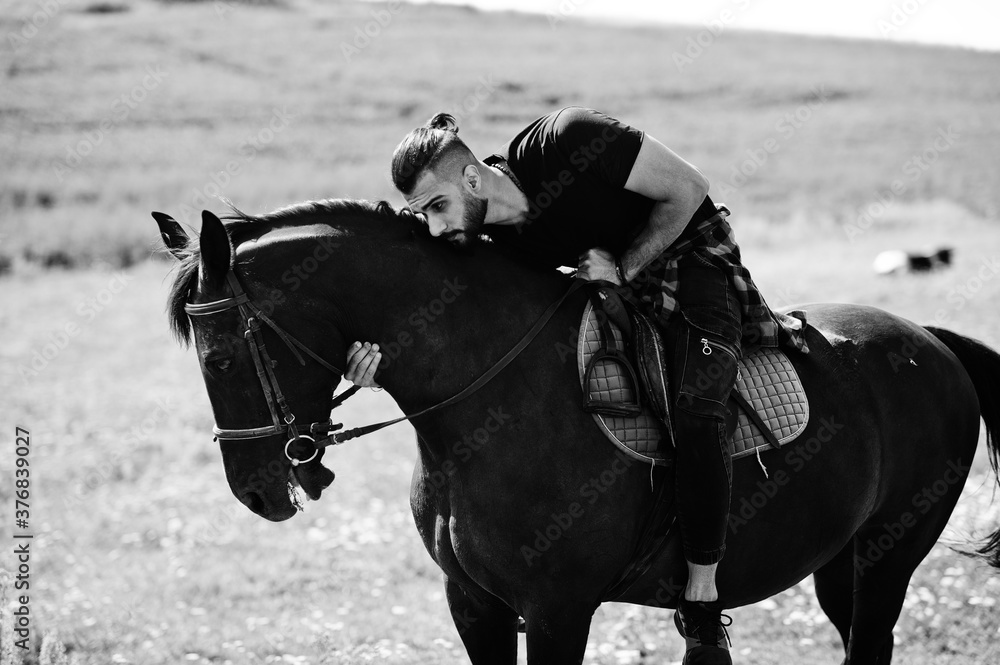 Arab tall beard man wear in black ride arabian horse. Arab tall beard man wear in black ride arabian horse.