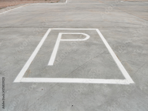 White parking sign on the ground without any arrow for directions in Thailand