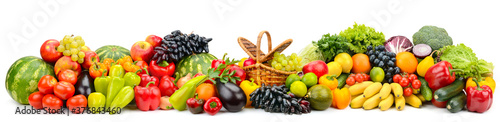 Wide panoramic composition of ripe  juicy fruits  berries and vegetables isolated on white