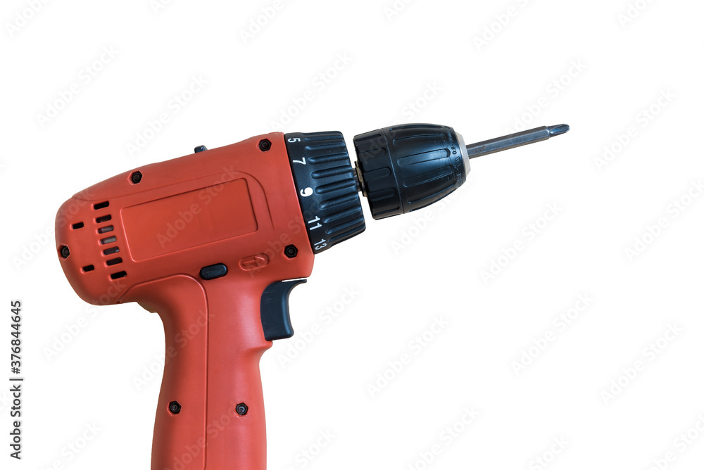 Portable Electric drill on a natural wood background .