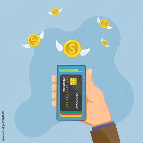 Man holds a smartphone in his hand with credit cards