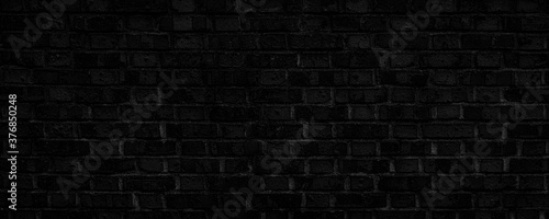 dark, dirty, rough-textured black brick background