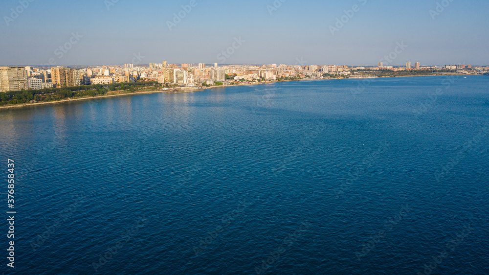 Governament Palace in the Center of Taranto, in the South of Italy and the waterfront of the city from  panoramic aerial view photo from flying drone.Taranto, Puglia, Italy (Series)
