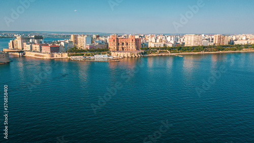 Governament Palace in the Center of Taranto, in the South of Italy and the waterfront of the city from  panoramic aerial view photo from flying drone.Taranto, Puglia, Italy (Series) photo