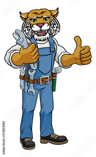 A wildcat cartoon animal mascot plumber, mechanic or handyman builder construction maintenance contractor holding a spanner or wrench and giving a thumbs up