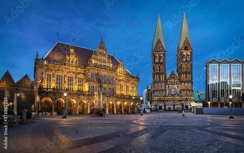 Bremen, Germany. Panorama of Market square at dusk with historic building of Town Hall and St Peter's Cathedral