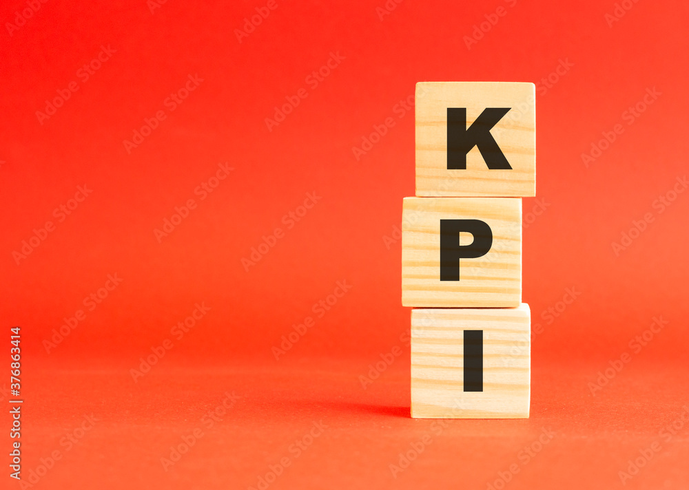 Wooden cubes with letters. For your design, concept. Wooden cubes on a red background. Free space on the left. Wooden cubes with letters. For your design, concept. Wooden cubes on a red background. Free space on the left.