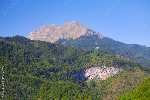 Mountain with grey peak and green base