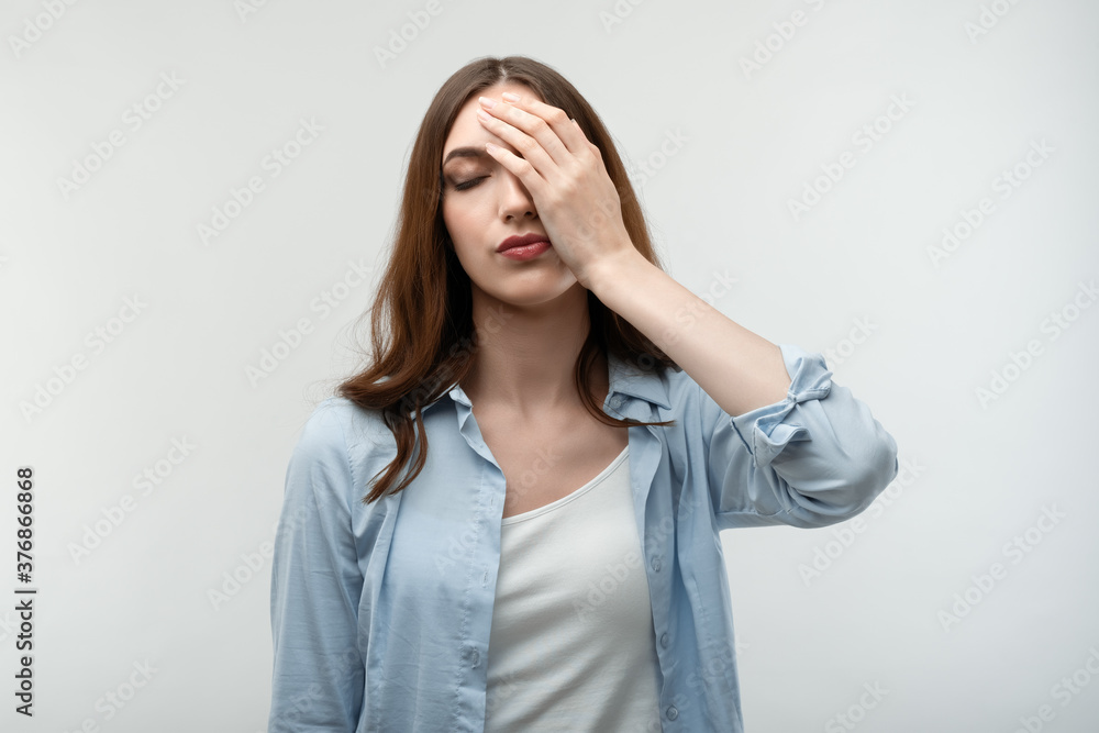 Photo of tired Young female covering face, feeling fatigue. Weariness and people Photo of tired Young female covering face, feeling fatigue. Weariness and people