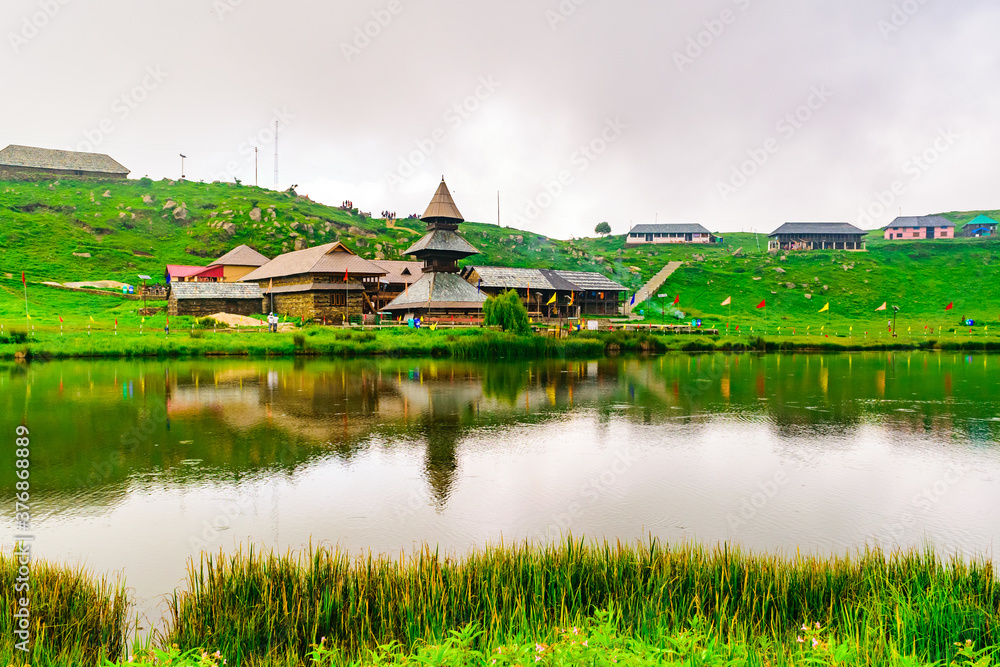 Obraz premium Prashar Lake is located at a height of 2730 m above sea level with a three storied pagoda-like temple of sage Prashar near Mandi, Himachal Pradesh, India. The lake has a floating island in it.
