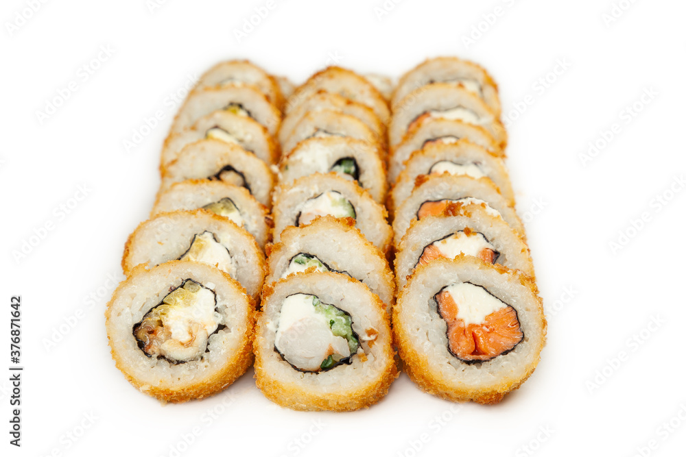 Tempura roll set on a white plate, classic Japanese sushi. Traditional Japanese food with maki. Delicious pieces of sushi. For the restaurant menu. copyspace