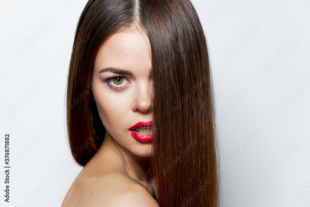 Woman portrait Long hair red lipstick bare shoulders bright makeup Woman portrait Long hair red lipstick bare shoulders bright makeup