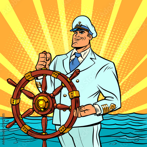 Captain in a white uniform at the helm of the ship