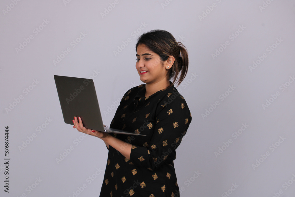 Beautiful Indian woman or girl working on laptop. Beautiful Indian woman or girl working on laptop.