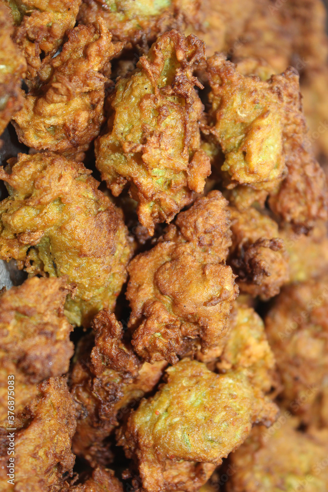 Pakora or pakoda, a traditional and popular Indian vegetarian snack Pakora or pakoda, a traditional and popular Indian vegetarian snack