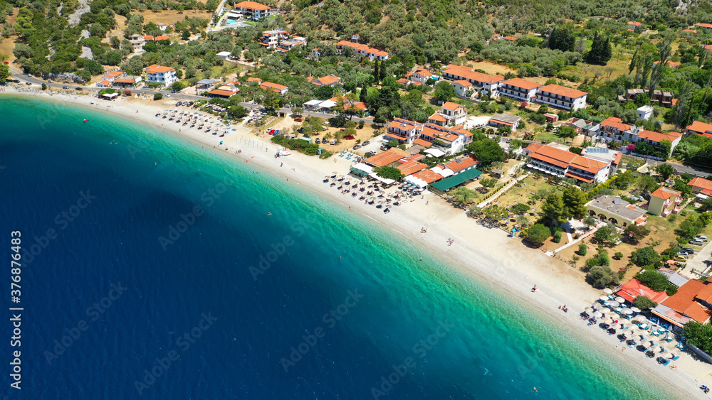 Aerial drone photo of famous crystal clear turquoise beach and bay of Panormos a popular safe sail boat anchorage in island of Skopelos, Sporades, Greece