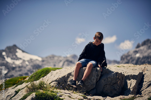 child enjoying in the mountains, child spending the holidays in the mountains