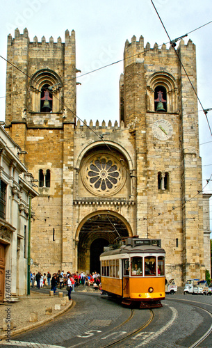 Lisbon Cathedral with the passage of the old tram in Portugal