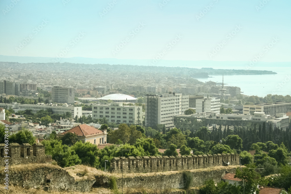 Surrounding walls of the Thessaloniki fortress, called Ano Poli, the upper town, or old city, with a panoramic aerial view of the city of Thessaloniki, also called Salonica, a major city of Greece