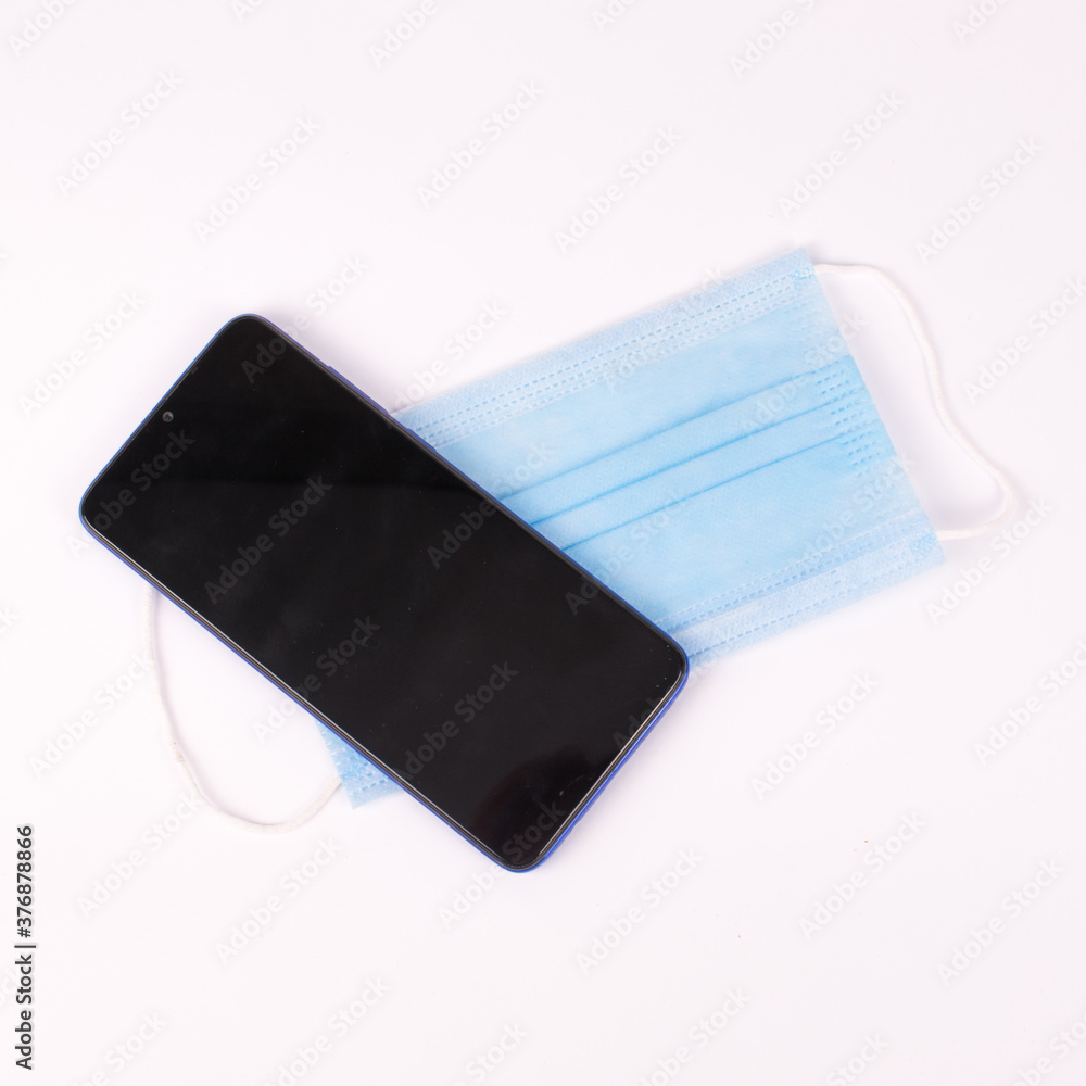 blue mask and telephone on white blue mask and telephone on white