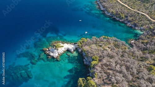 Fototapeta Naklejka Na Ścianę i Meble -  Aerial drone photo of famous from Mamma Mia movie Three pine cape Amarantos a trully scenic place with crystal clear sea, Skopelos island, Sporades, Greece