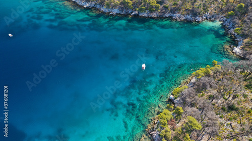 Aerial drone photo of famous from Mamma Mia movie Three pine cape Amarantos a trully scenic place with crystal clear sea, Skopelos island, Sporades, Greece © aerial-drone