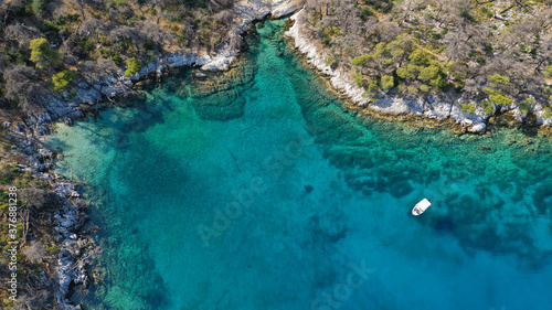 Aerial drone photo of famous from Mamma Mia movie Three pine cape Amarantos a trully scenic place with crystal clear sea, Skopelos island, Sporades, Greece photo