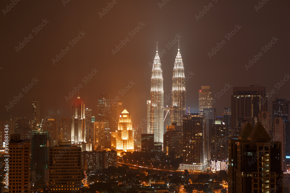 Top view of Petronas towers skyline at twilight, night time. Travel Malaysia, Luala Lmpur city centre