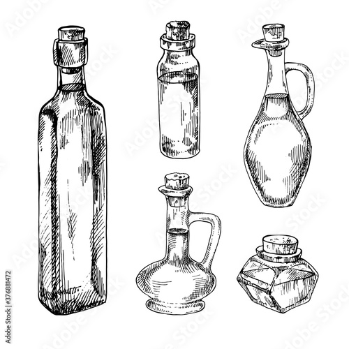 Hand drawn vector illustration set of glass bottles. Engraved objects for cosmetics, medicine, treating, cuisine, kitchen, aromatherapy, package design healthcare.