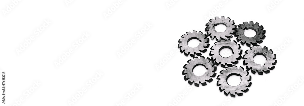 Banner with several metal milling disc cutters for industrial equipment. The tool is isolated on a white background with free copy spase. Close-up